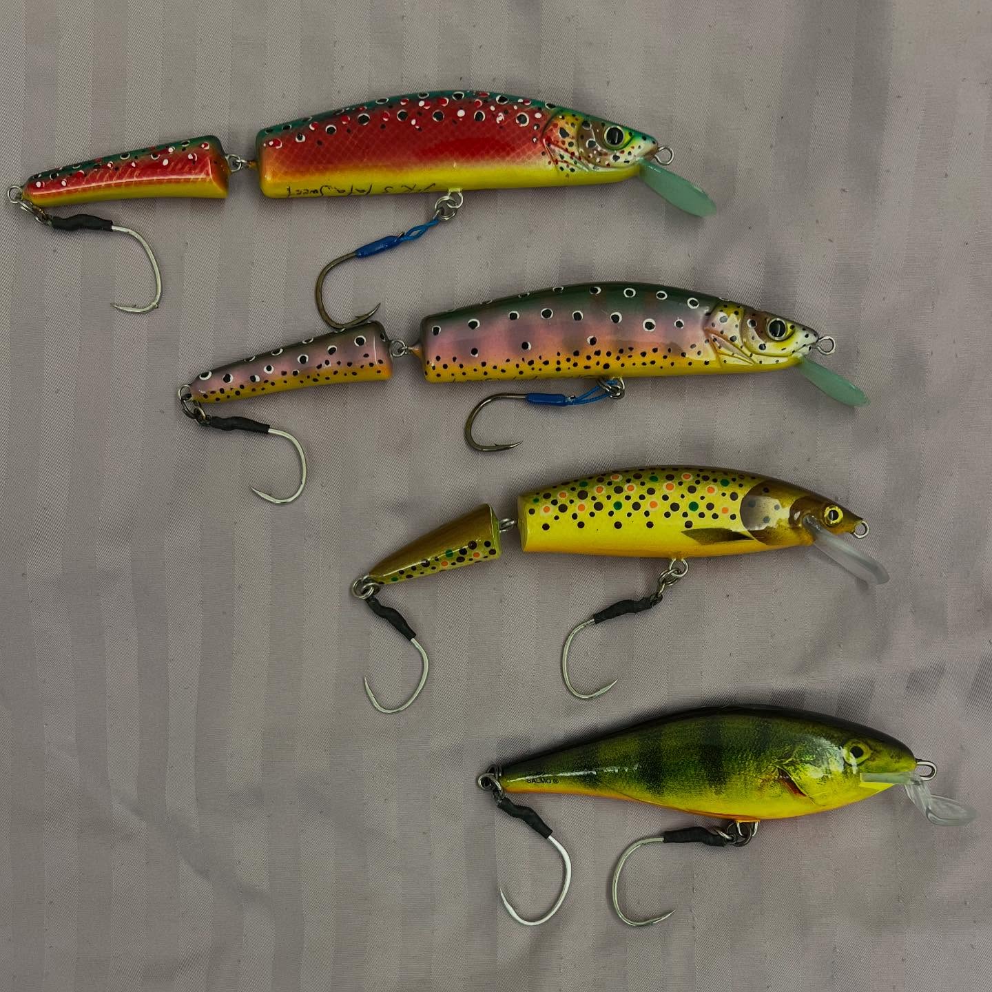Show you my best lures for the Taimen fishing. Jointed ones called Serbian Lure. One of the best lure for Taimen, and they work really great. Two at the top from lure master Tatiana Varycheva @sweet_fish_2507 and Alexander Kislicyn. Those huge trophy I set on red one. Next one made by Vladimir Petrik, got descent size as well. And I wonder about Salmo Executor lure which is also works well by that conditions where was lot of grass and quite shallow @salmo_fishing