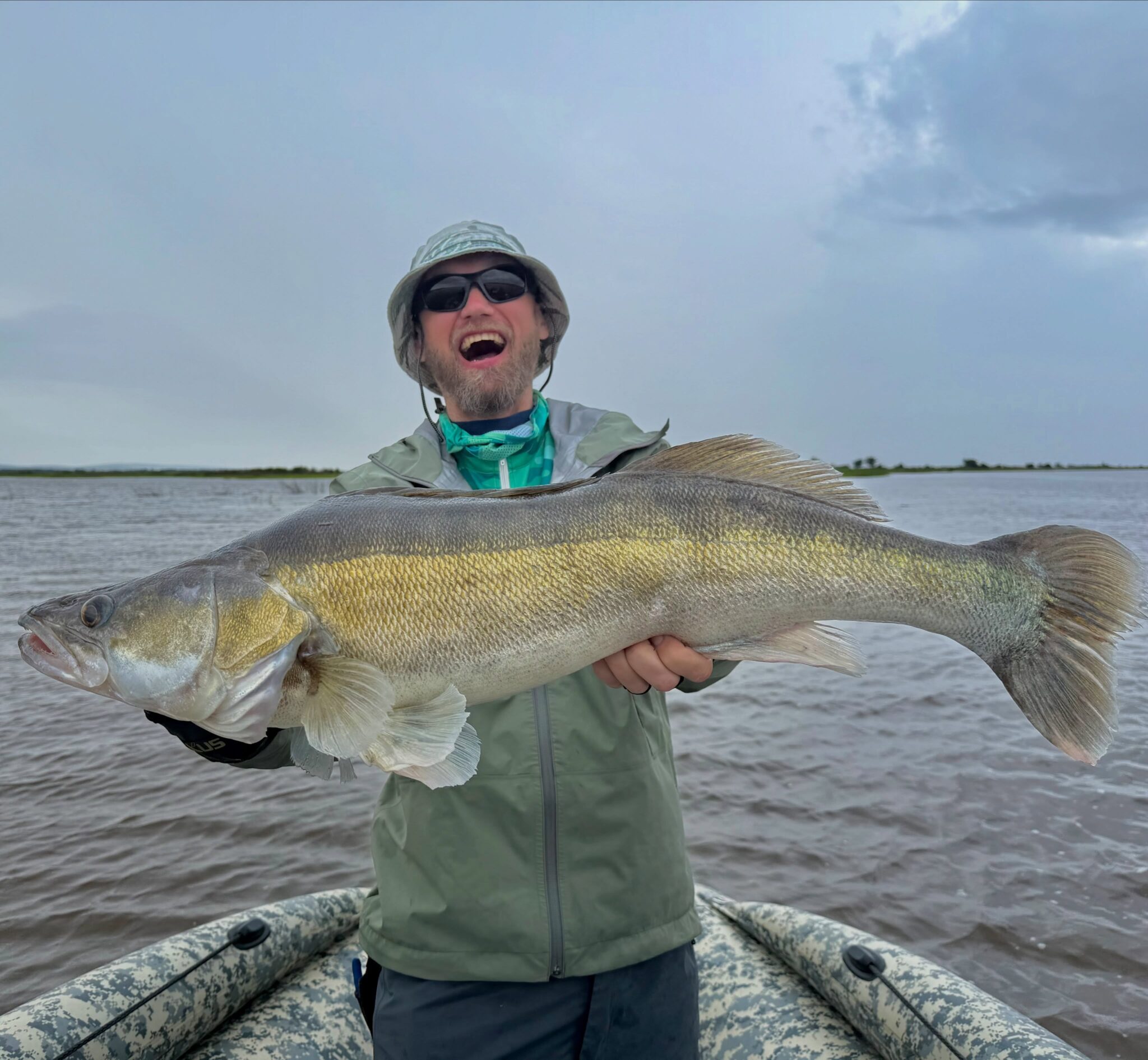 Fishing Amur river, day fourth. Now that was a complete surprise! It was a European zander, weighing in at 6.2 kg. A new record, indeed. I managed to land him pretty quickly, set the hook as hard as usual, and he spat the bait right out of the net.

Still no luck with the Mandarin fish. Everyone in my team already caught it. And there’s only one more day left...

By the way, another fish got away this morning, a much larger one. I thought it was a snag, but it just started moving toward me and apparently didn’t catch it. Either a catfish or a zander.